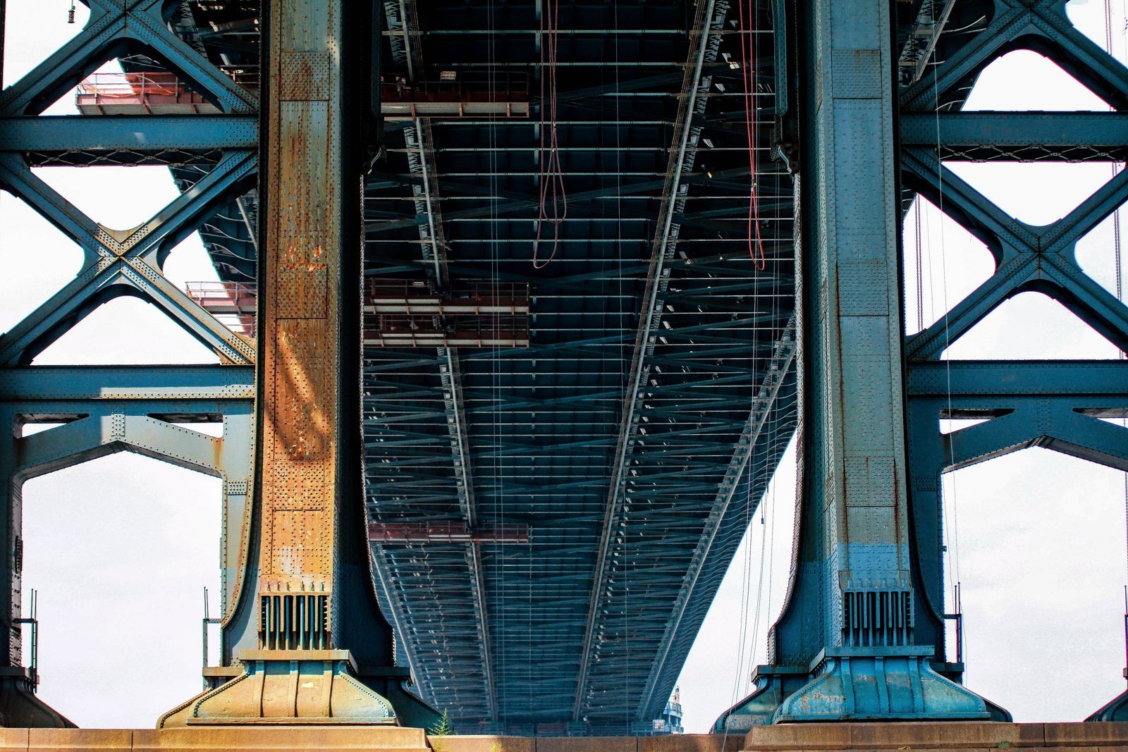Underside of a steel truss bridge