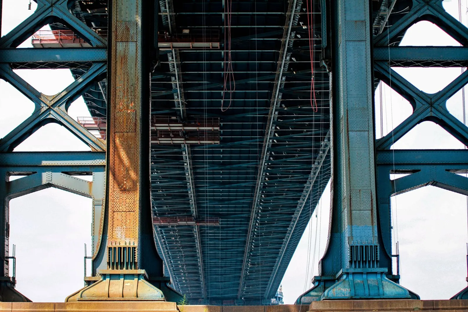 Underside of a steel truss bridge